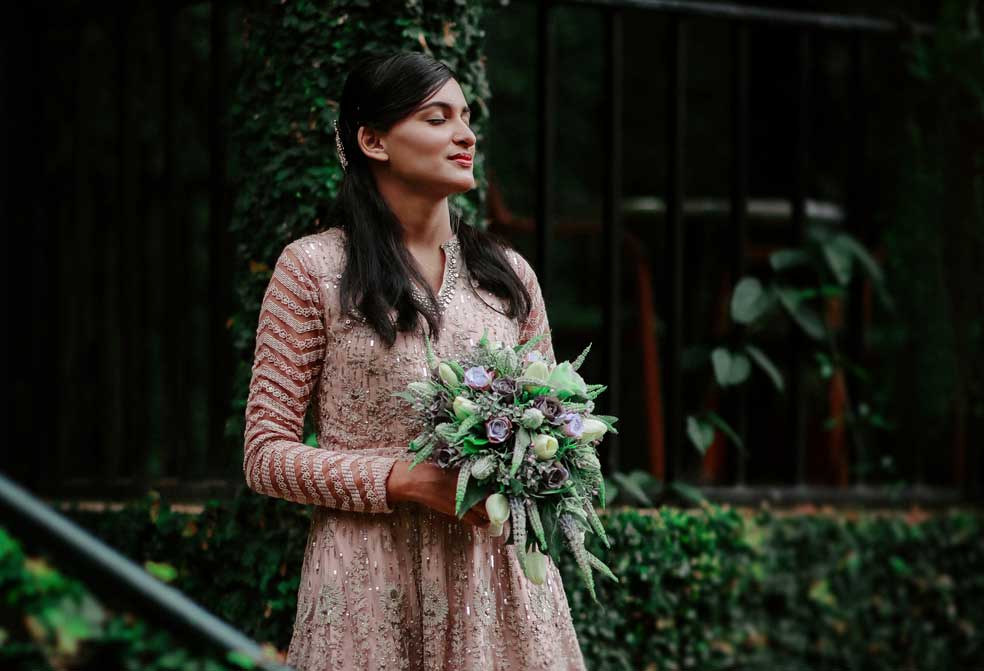 entry of the bride in grace at the cardamom county by xandari resort